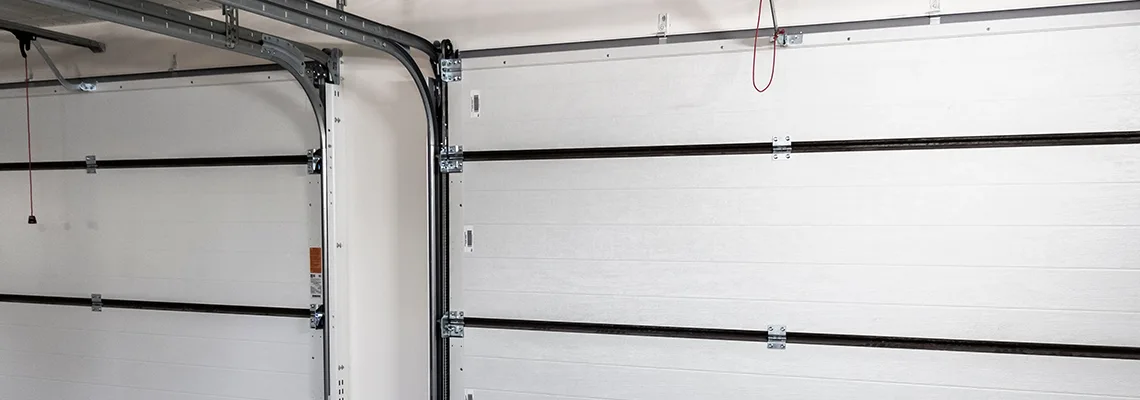 Fix Folding Garage Door Jerking in Boca Raton